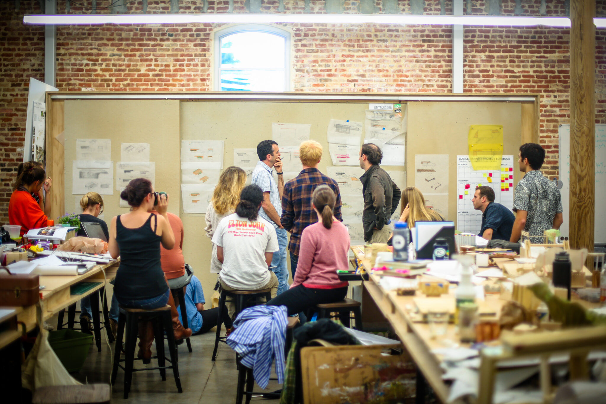 Architecture students working at design board.